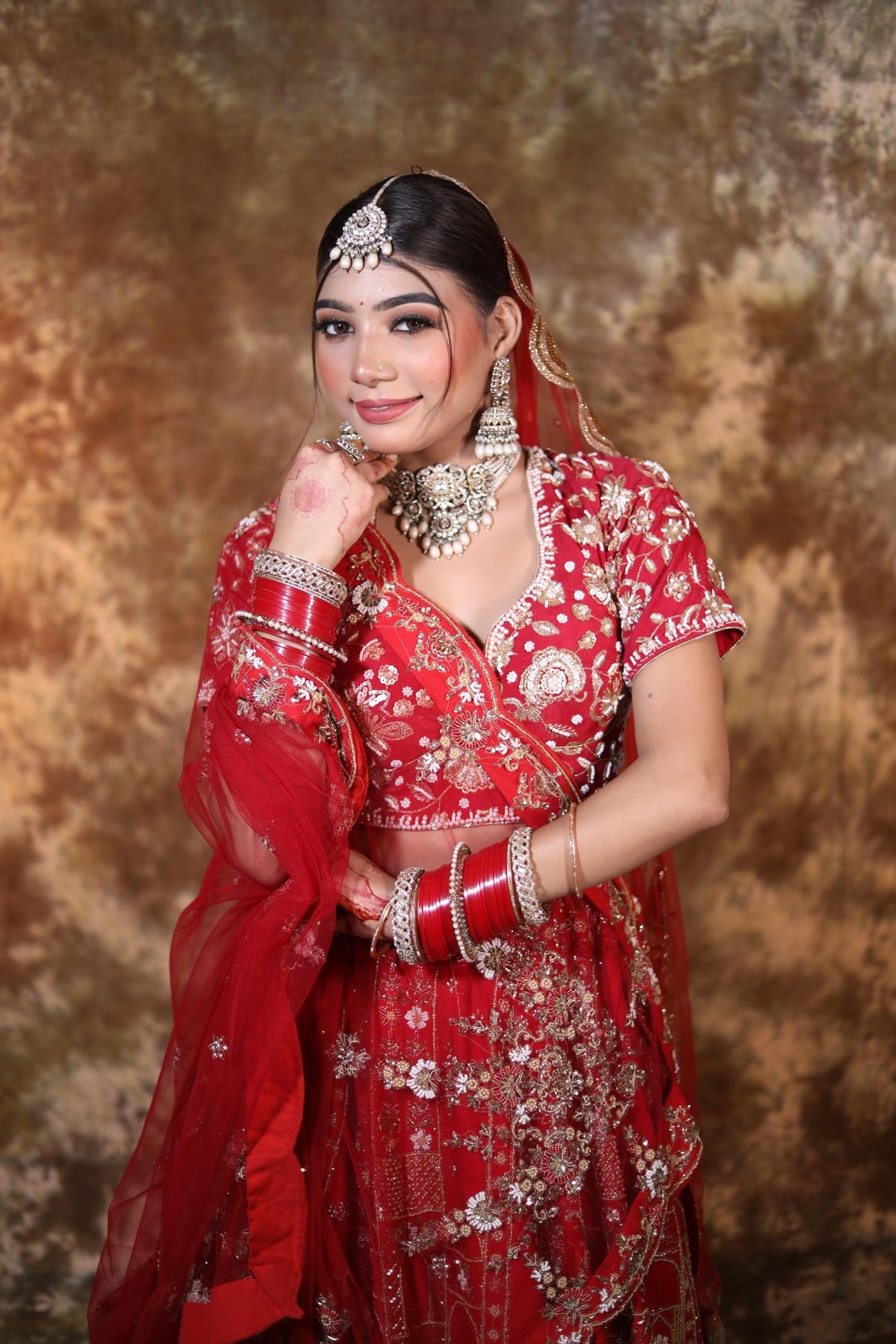 HD bridal makeup with soft pink lips and defined eyes