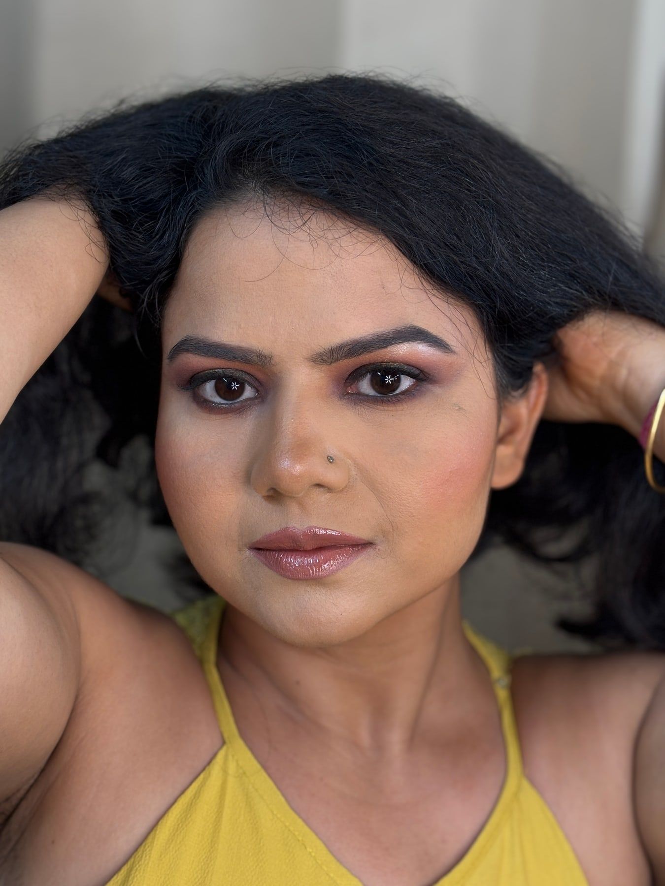 Same client after party makeup with smokey eyes and voluminous hair