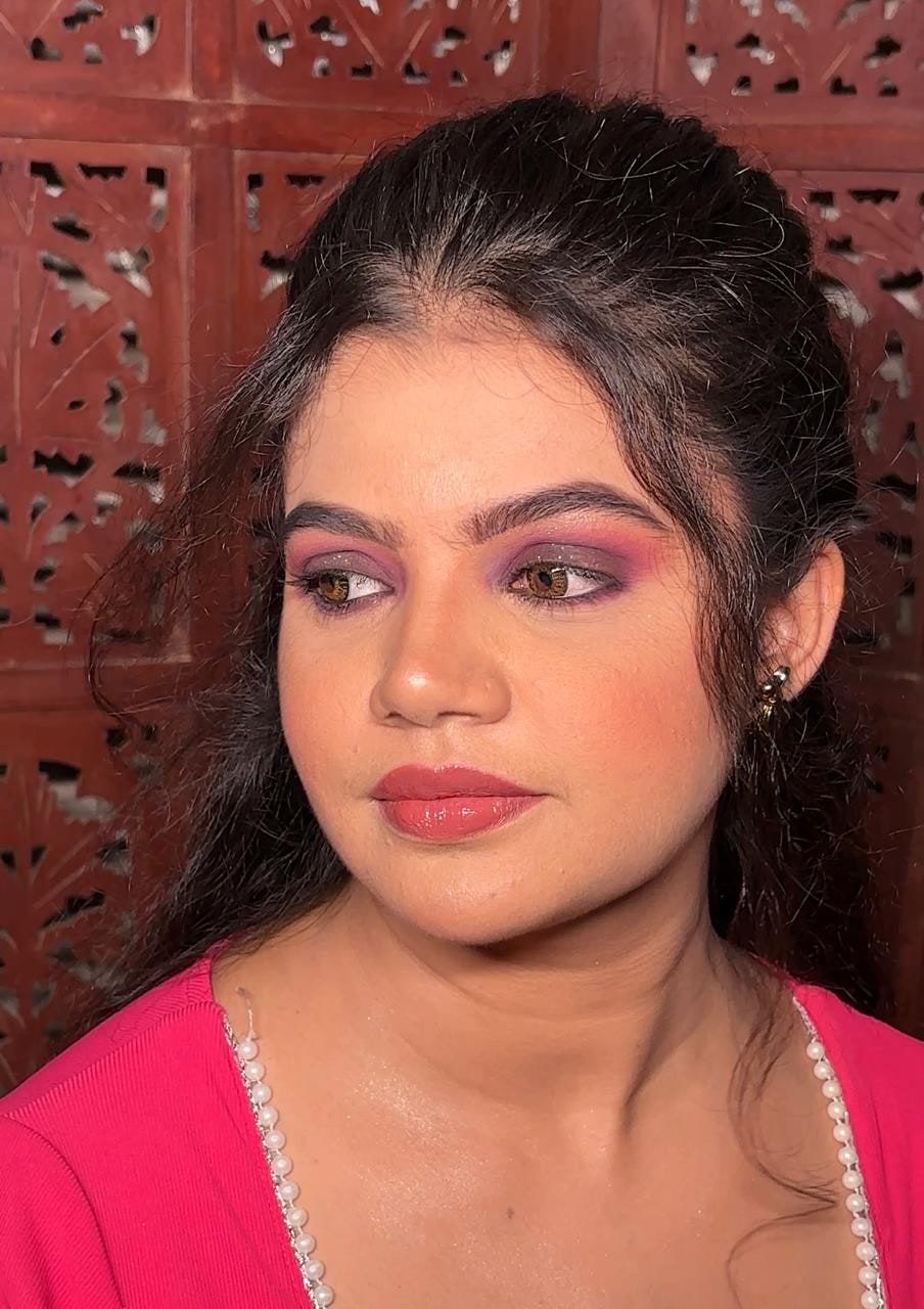 Party makeup with purple smokey eyes and coral lips
