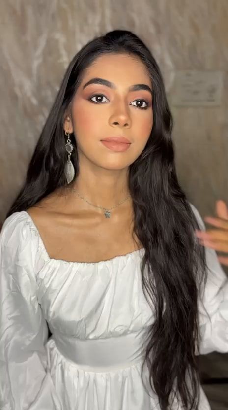 Soft-glam day makeup with rosy eyes, glowing skin and long open hair